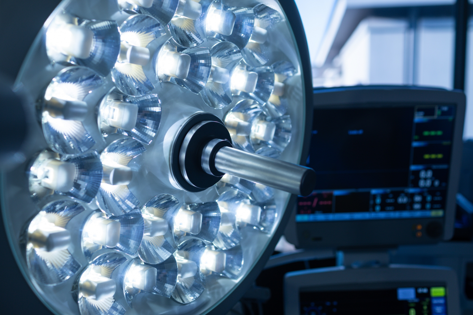 Close-up of surgical light and medical monitorsÂ in operation theater at hospital.